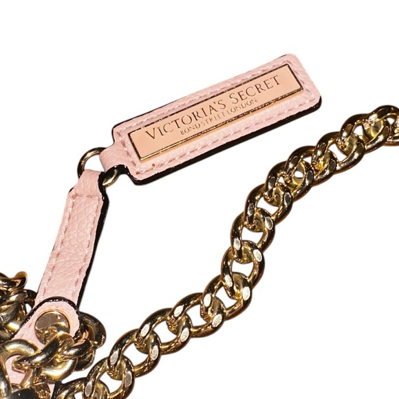 Victoria Secret purse has thick gold chain shoulder strap, magnetic snap pinkish